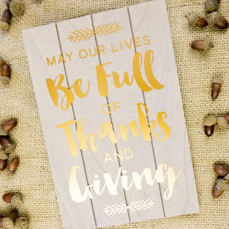 Thanksgiving wall art with words "May Our Lives Be Full of Thanks and Giving" free svg file that embodies a sense of gratitude and generosity in our lives.