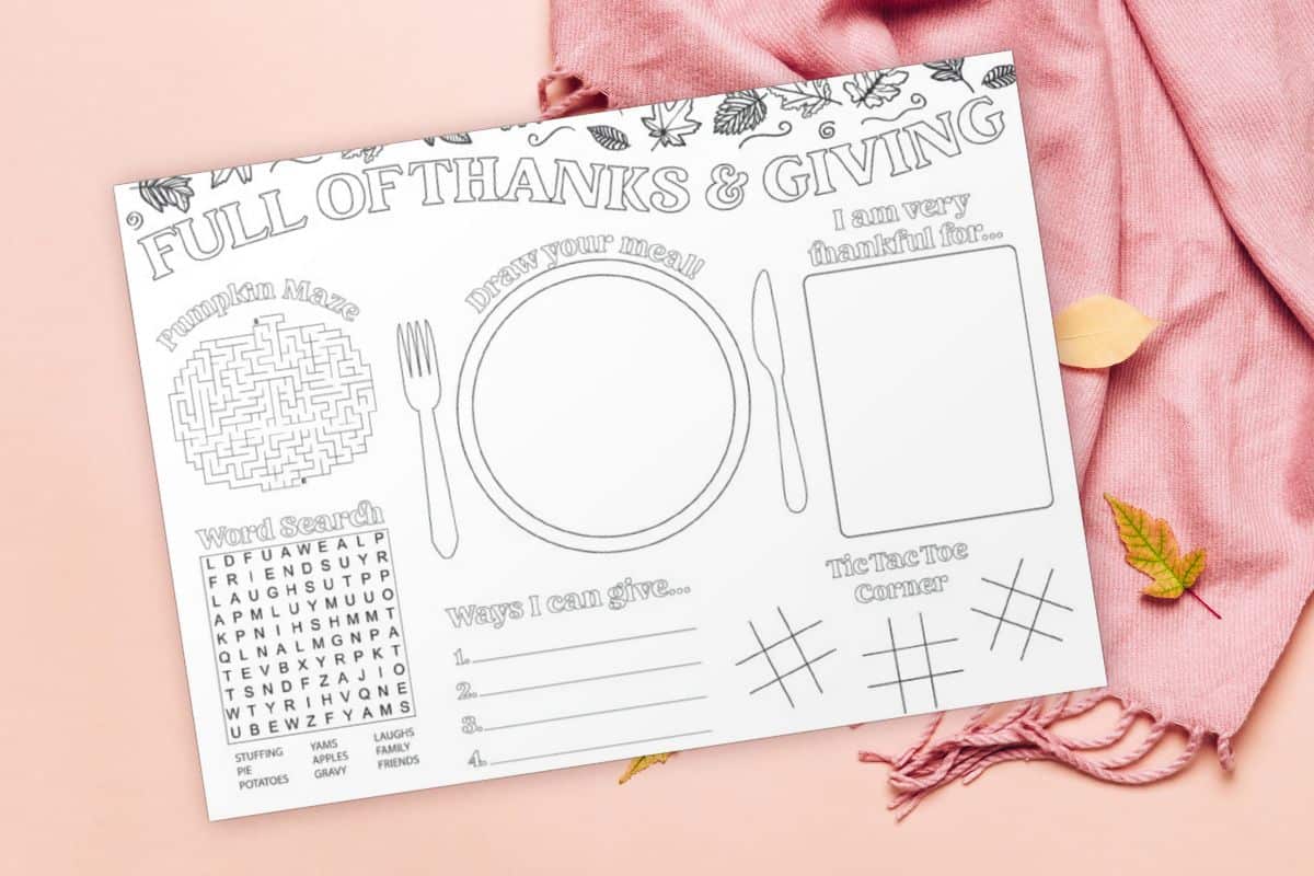 Free thanksgiving activity placemat printable on pink scarf background with leaves